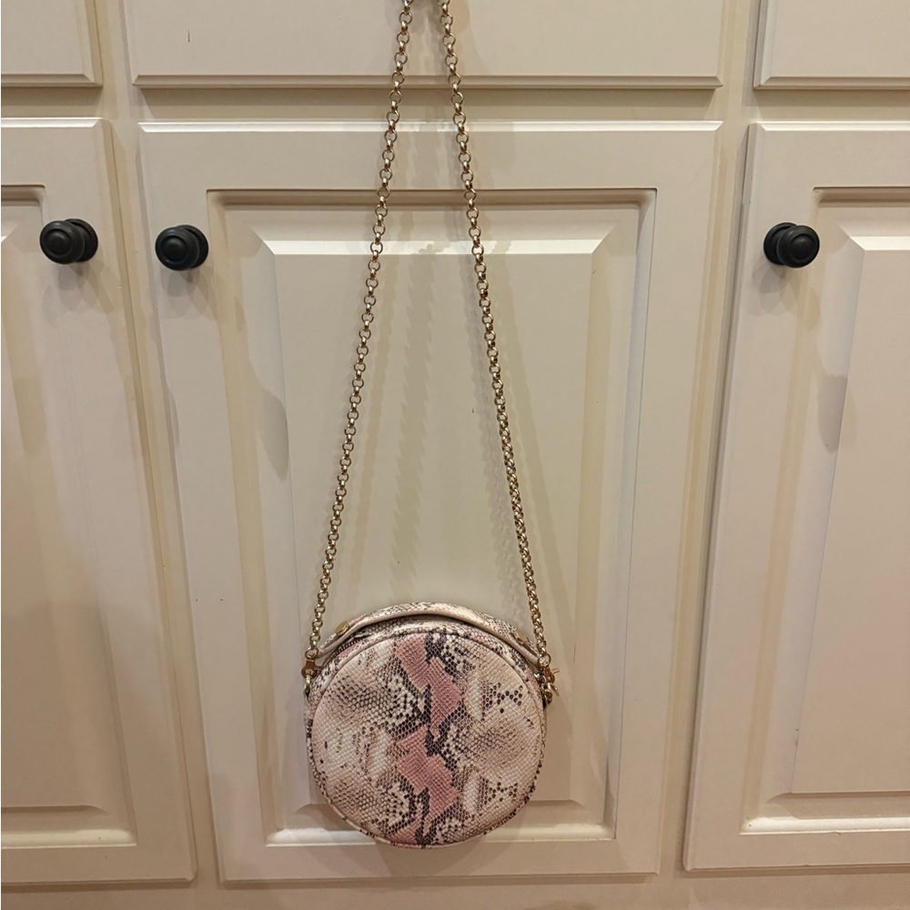 Kelly Wynne Pink and Cream Snake Skin Print Round Crossbody Bag